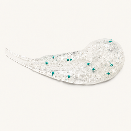 ZO Exfoliating Cleanser clear gel texture with teal vitamin E beads.