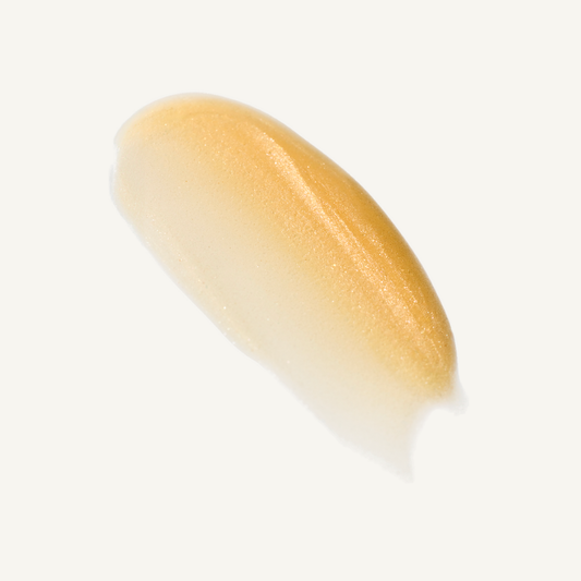 Facile Lip Jelly Champagne sheer golden shimmer swatch on a warm cream background