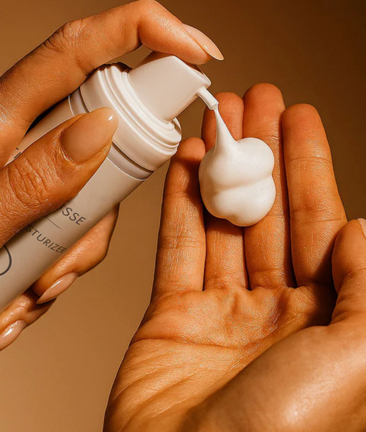 CO2Lift Skin Mousse dispensed into a hand showing its airy whipped texture