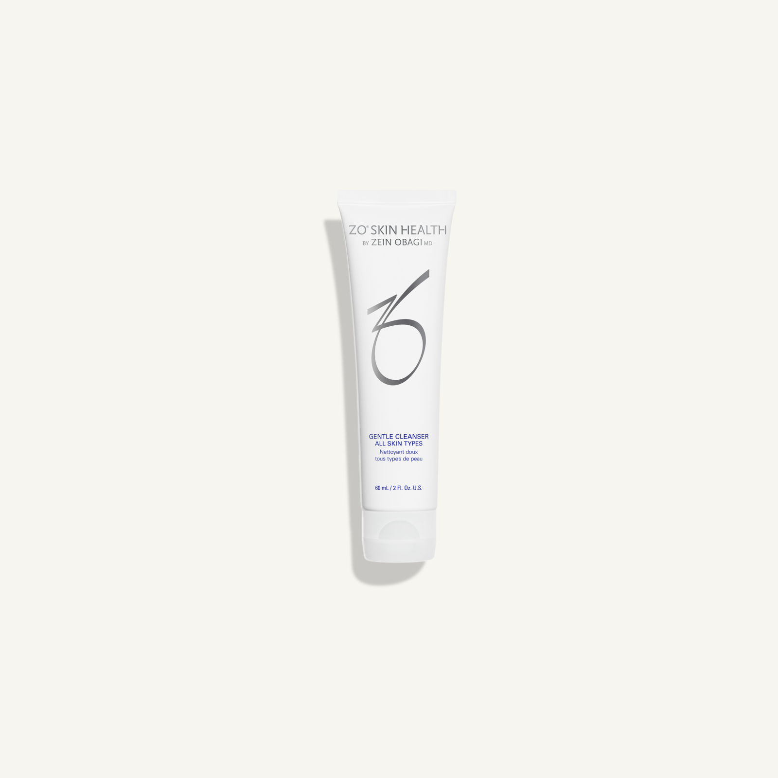 ZO Gentle Cleanser 60 mL travel-size tube on warm cream background
