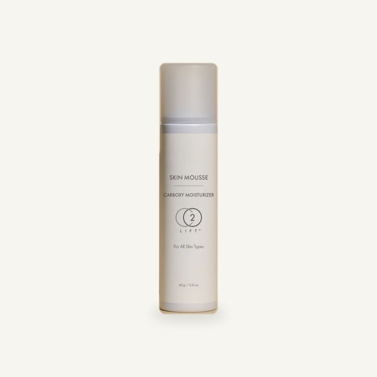 CO2Lift Skin Mousse Carboxy Moisturizer 60 g bottle on a warm cream background