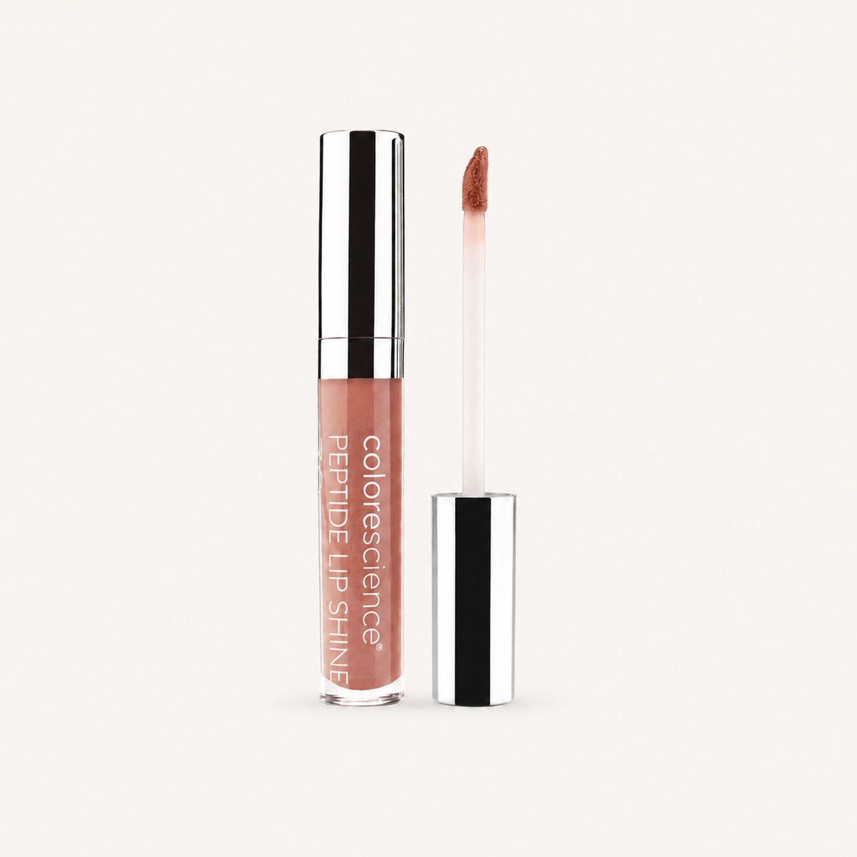 Colorescience Peptide Lip Shine in Champagne with applicator on a warm cream background