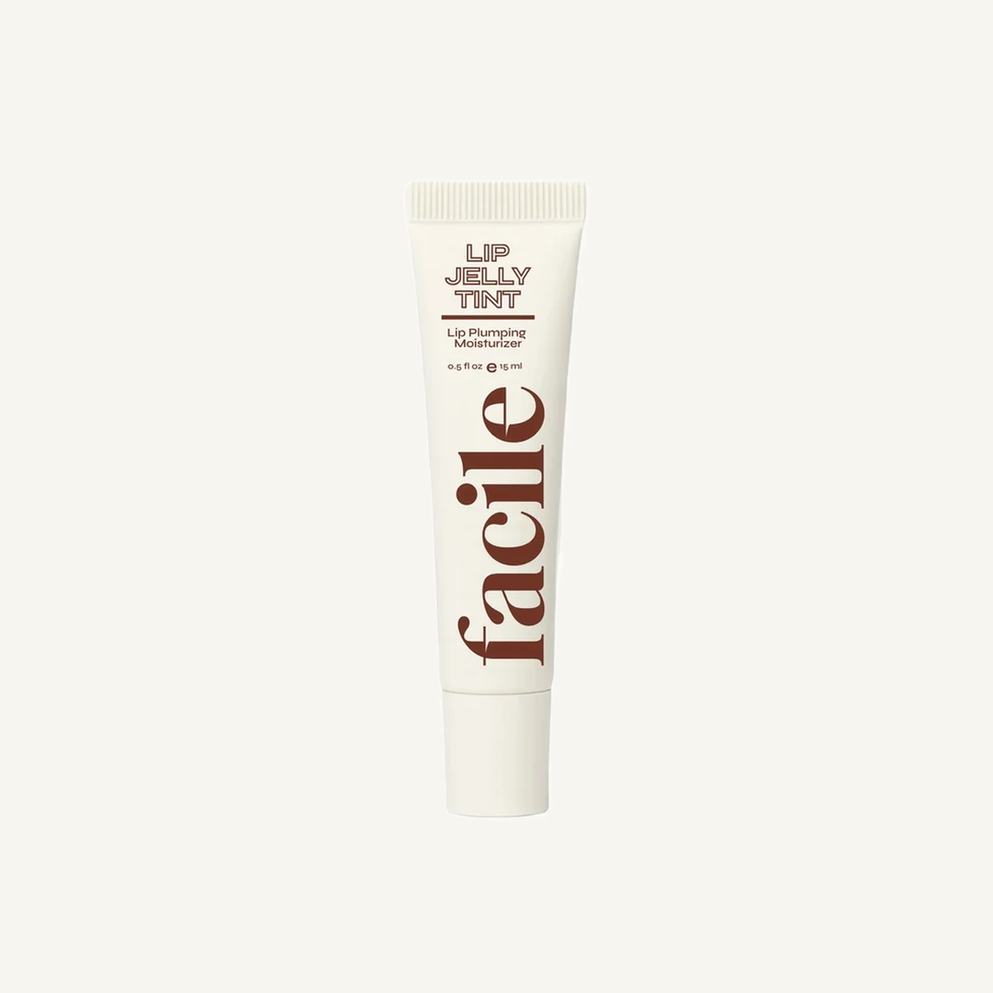 Facile Lip Jelly Clove 15 mL tube on a warm cream background