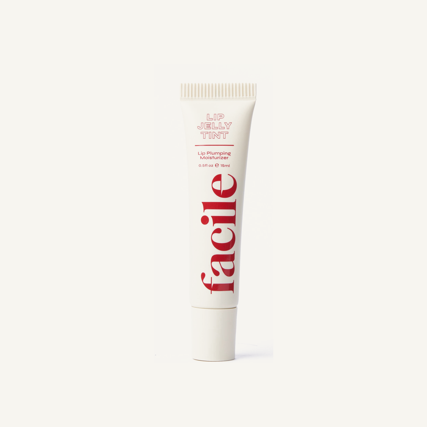 Facile Lip Jelly Rouge 15 mL tube on a warm cream background
