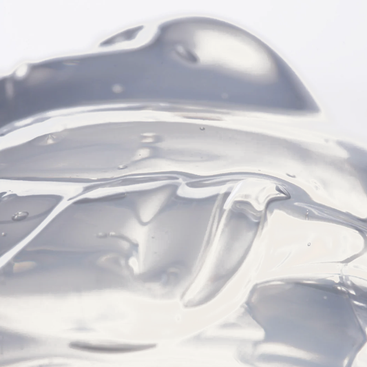 Facile Lip Jelly Untinted clear glossy gel texture on a warm cream background