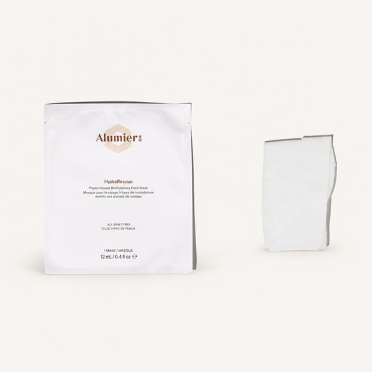 AlumierMD HydraRescue BioCellulose Face Mask single sachet and folded mask on a warm ivory background